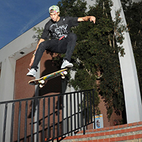man skateboards down stairs